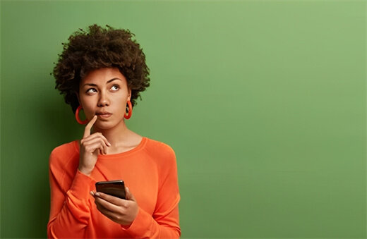 Image of a woman thinking about how to use TikTok in case it gets banned in the US - LDCloud Cloud Android Emulator